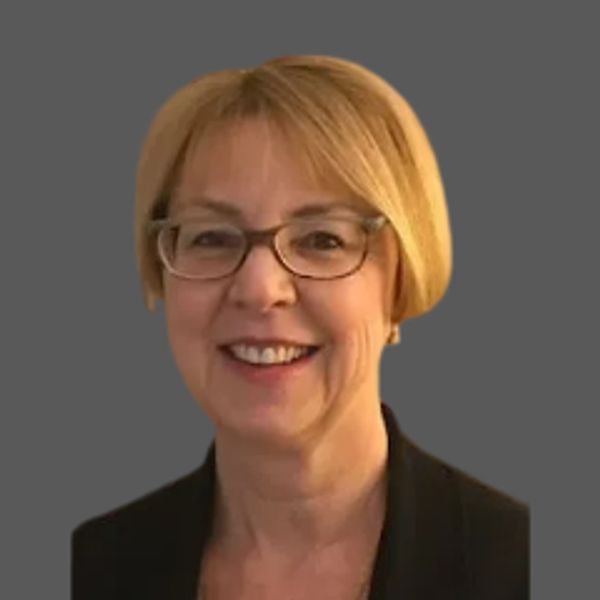 Wendy LaBate, smiling woman with glasses and short blonde hair